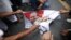 Muslims burn a picture of Burma's president Thein Sein as they protest in front of Burma's embassy in Bangkok, June 21, 2012. 