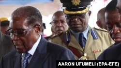 ZIMBABWE ARMY TAKES CONTROL OF GOVERNMENT -- Zimbabwean President Robert Mugabe (C) makes his first public appearance four days after the Zimbabwe National Army (ZNA) took over control of government in Harare, Zimbabwe, 17 November 2017. 