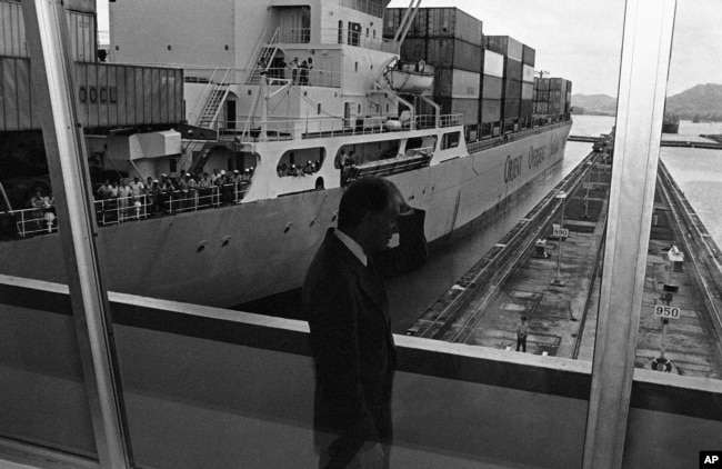 FILE - President Jimmy Carter views the Panama Canal at the Miraflores Locks in Canal Zone, June 17, 1978. Carter signed the final Panama Canal Treaties giving control of the canal to Panama in 2000.