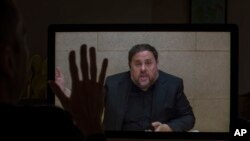FILE - The leader of the Catalan ERC party and European Parliament candidate Oriol Junqueras speaks from Soto del Real prison in Madrid, May 24, 2019, during an interview via video conference with The Associated Press in Barcelona, Spain. 