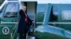 President Donald Trump gestures as he boards Marine One on the South Lawn of the White House, Wednesday, Jan. 20, 2021, in Washington. Trump is en route to his Mar-a-Lago Florida Resort. (AP Photo/Alex Brandon)