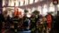 First responders evacuate wounded persons on Piazza della Repubblica in central Rome on Oct. 23, 2018, after at least 20 people were injured when an escalator leading to the Repubblica metro station collapsed.