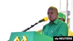 Tanzania's President John Magufuli addresses supporters during a campaign rally at the Tanganyika Parkers Grounds in Kawe in Dar es Salaam, Tanzania, Oct. 14, 2020. 