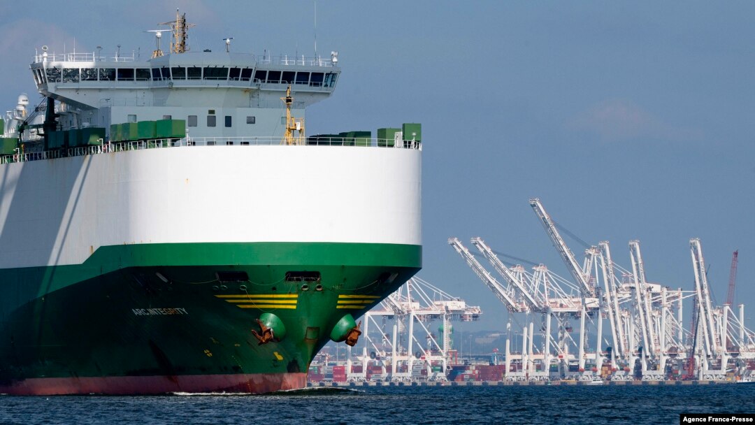 FILE - A cargo ship passes the Port of Baltimore in Baltimore, Oct. 14, 2021.