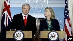 Australia's Foreign Minister Kevin Rudd talks as Secretary of State Hillary Rodham Clinton looks on during a meeting at the State Department in Washington, Monday, May 2, 2011. (AP Photo/Luis M. Alvarez)