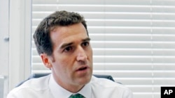 FILE - Newly appointed CONCACAF Secretary-General Enrique Sanz speaks during an interview in Miami, July 23, 2012.