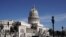 Police stand guard near the National Capitol building in Havana, Cuba, Monday, July 12, 2021, the day after protests against food shortages and high prices amid the coronavirus crisis.