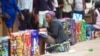 A Zimbabwean vendor selling some goods ... (AP)