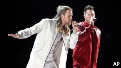 FILE - Tyler Hubbard, right, and Brian Kelley, of Florida Georgia Line, perform "Meant to Be" at the 53rd annual Academy of Country Music Awards in Las Vegas, April 15, 2018. The duo, along with Carrie Underwood and Jason Aldean are the leading nominees for the CMT Music Awards with four each.