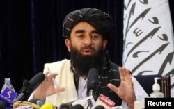 FILE - Taliban spokesman Zabihullah Mujahid speaks during a news conference in Kabul, Afghanistan, August 17, 2021.