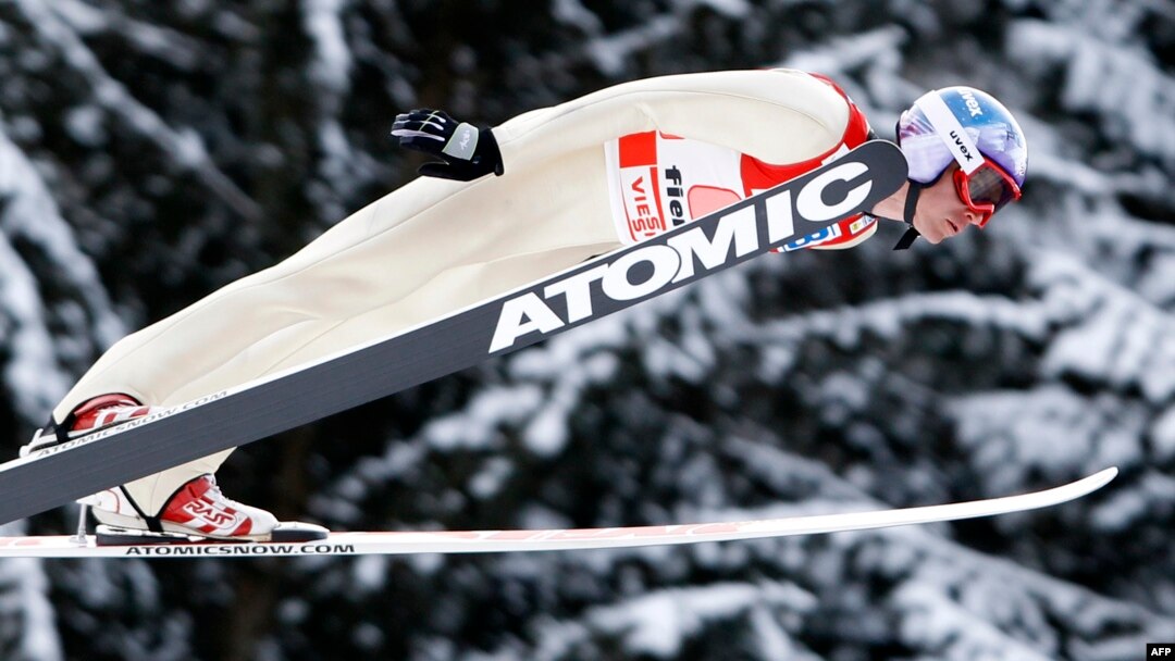 FILE - Bill Demong of the U.S. soars through the air during the LH team sprint ski jumping portion of the World Cup Nordic Combined event in the northern mountain resort of Predazzo, Feb. 4, 2012. 