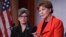 Sen. Jeanne Shaheen, D-N.H., right, standing with Sen. Joni Ernst, R-Iowa, announces in Washington, Feb. 7, 2018, a bipartisan resolution that would establish a special Senate committee to investigate the USOC and USA Gymnastics regarding how team doctor Larry Nassar was allowed to sexually abuse female gymnasts over decades. 