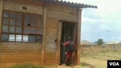 A pupil walks into a dilapidated classroom at the Grace Mugabe Primary School in Hatcliffe. (Photo/Irwin Chifera)