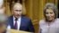 FILE - Russian President Vladimir Putin and Federation Council Speaker Valentina Matviyenko attend the Eurasian Women's Forum in St. Petersburg, Russia, Sept. 20, 2018. A report that Matviyenko would be leaving her post led to the journalists' firing. 
