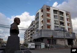 FILE - A statue of Iranian General Qassem Soleimani, former head of Iran's Quds force, stands in front of a branch of the Hezbollah-run Al-Qard al-Hassan banking institution in Ghobeiry, Lebanon, on Jan. 20, 2021.