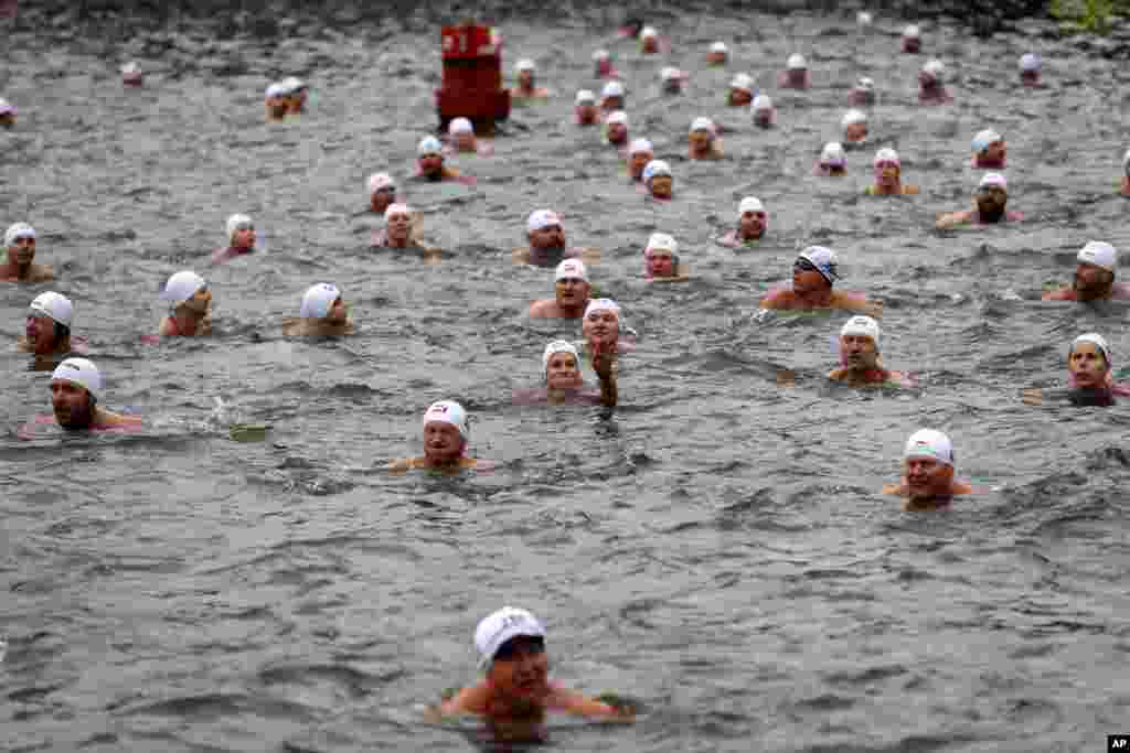 Polar swimmers participate in a traditional Christmas swim in the Vltava river in Prague, Czech Republic.