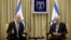 Israeli Prime Minister Benjamin Netanyahu and Israeli President Simon Peres speak during a brief ceremony in the president's residence in Jerusalem, March 2, 2013.