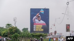 FILE —Incumbent President of the Democratic Republic of the Congo Felix Tshisekedi's campaign poster is seen in the vicinity of the Union for Democracy and Social Progress political party headquarters in Kinshasa on November 19, 2023. 