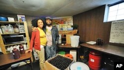 Pierre and Jamyla Bennu pose in their basement production facility in their home in Baltimore (File)