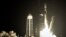 A SpaceX Falcon 9 rocket lifts off from pad 39A with a payload of a pair of lunar landers at the Kennedy Space Center in Cape Canaveral, Fla., Wednesday, Jan. 15, 2025. (AP Photo/John Raoux)