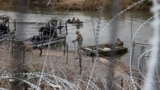 (FILE) Army National Guard soldiers return from a boat patrol on the Rio Grande River at the U.S.-Mexico border in Eagle Pass, Texas, U.S., February 7, 2025.