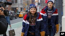 Ice dancing pair and sister and brother Maia and Alex Shibutani, who will participate in the upcoming winter Olympics in Pyeongchang, South Korea, model Team USA's opening ceremony uniforms. 