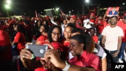 Supporters celebrate the general election victory of Hubert Minnis of Free National Movement, May 10, 2017 in Nassau, Bahamas. 