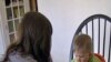 Rachel Gibson feeding her child