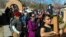 Jasmin Perez, 17, of Espanola, New Mexico, carries a cross on a pilgrimage to a small adobe church in Chimayo, New Mexico, March 30, 2018. She joined thousands of Catholics who traveled by foot to El Santuario de Chimayo in the hills of northern New Mexico in an annual Good Friday pilgrimage that has endured for two centuries. 