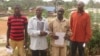 Left to right, Manso Turay, James Conteh, Father Kargbo, Mohamed Barrie pose outside the Radisson hotel in Freetown, Feb. 5, 2018, before a hearing where a British court heard testimony of the alleged complicity of a British mining company in police brutality, including rape. 