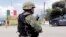 A Mexican soldier stands guard at a checkpoint in Iguala, Guerrero State, Mexico, Sept. 29, 2014, following recent clashes that led to at least six deaths.