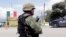 FILE - A Mexican soldier stands guard at a checkpoint in Guerrero State, Mexico, Sept. 29, 2014.