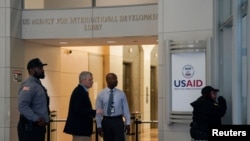 Security personnel work, as the USAID building sits closed to employees after a memo was issued advising agency personnel to work remotely, in Washington, D.C., Feb. 3, 2025.