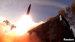 A missile launch is seen at an undisclosed location in North Korea