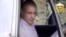 In this image taken from video obtained from Voice Of Jihad Website, which has been authenticated based on its contents and other AP reporting, Sgt. Bowe Bergdahl sits in a vehicle guarded by the Taliban in eastern Afghanistan.