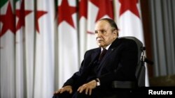 FILE - President Abdelaziz Bouteflika looks on during a swearing-in ceremony in Algiers, Algeria. 