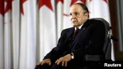 FILE - President Abdelaziz Bouteflika looks on during a swearing-in ceremony in Algiers, Algeria, April 28, 2014. 