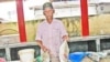 Marcel Santache, 66, a fisherman displays his tuna catch at the local main market in Victoria, Seychelles