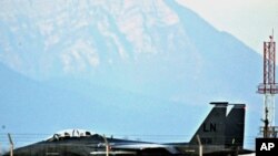 A U.S. Air Force F-15E Strike Eagle fighter jet taxis before taking off from the NATO airbase in Aviano, March 21, 2011