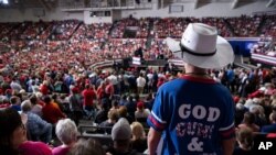 FILE - Supporters of President Donald Trump listen as he speaks during a campaign rally at the Monroe Civic Center, Nov. 6, 2019, in Monroe, La.