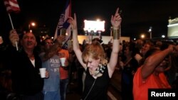 People celebrate after the announcement of the death of Cuban revolutionary leader Fidel Castro in the Little Havana district of Miami, Florida, U.S. November 26, 2016. 