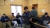 FILE - Kashmiri journalists browse the internet on their mobile phones inside the media center set up by government authorities in Srinagar, Indian controlled Kashmir, January 30, 2020.