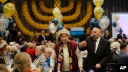 Two holocaust survivors arrive for the International Holocaust Survivors Night of the Jewish Community in Berlin, Germany, Dec. 4, 2018.