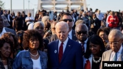 U.S. President Biden participates in a commemorative civil rights march across the Edmund Pettus Bridge in Selma, Alabama