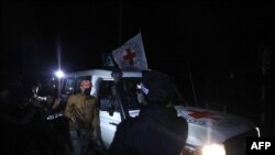 An International Red Cross vehicle reportedly carrying hostages released by Hamas drives towards the Rafah border point with Egypt ahead of their transfer to Israel on November 25, 2023.