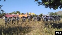 Police at the Letpadaung Copper Mine in northern Myanmar prepare for a confrontation with protesters, Dec. 22, 2014. (photographer unknown) 