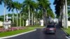 FILE - A motorcade with President Donald Trump drives into the Trump International Golf Club in West Palm Beach, Fla., Nov. 21, 2018. 