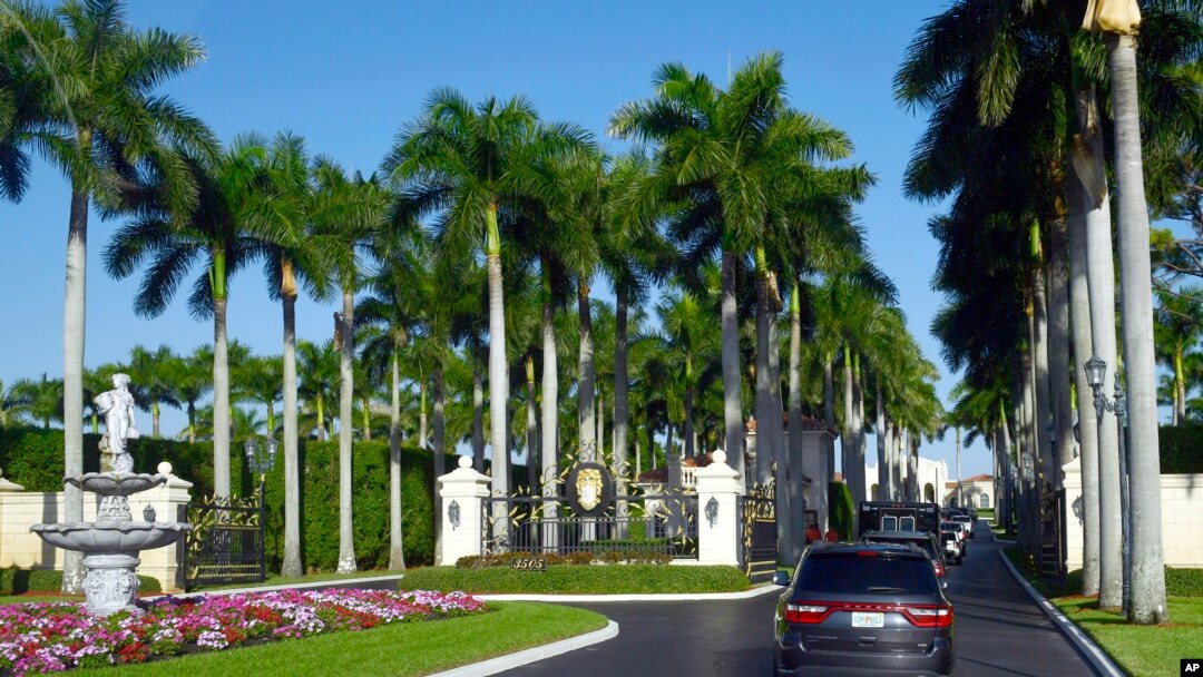 FILE - The motorcade with President Donald Trump, drives into the Trump International Golf Club in West Palm Beach, Florida, Nov. 21, 2018. 