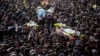 Syrian Kurds attend a funeral of people killed in Turkish airstrikes in the village of Al Malikiyah , northern Syria, Nov. 21, 2022. 