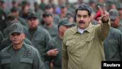Venezuela's President Nicolas Maduro gestures during a meeting with soldiers at a military base in Caracas, Venezuela, Jan. 30, 2019. 